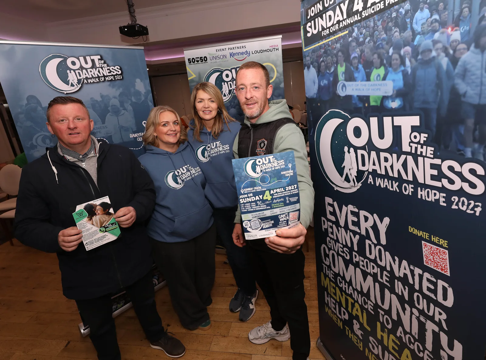 Supporters gathered together beside the walk banner at the Balmoral Hotel.