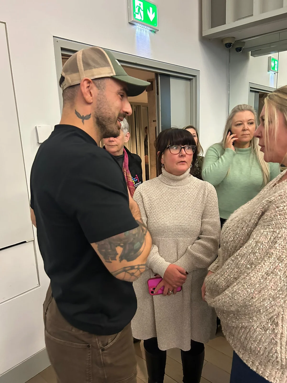Attendees talking together after the Traumality screening at The MAC.