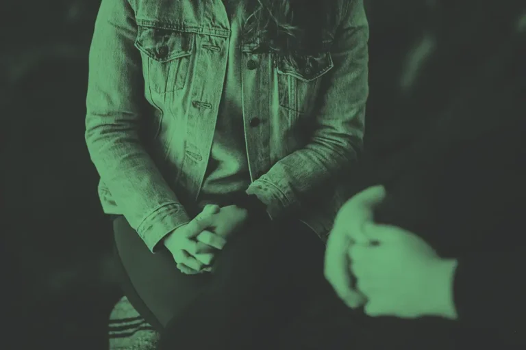 Two people talking in a calm counselling space